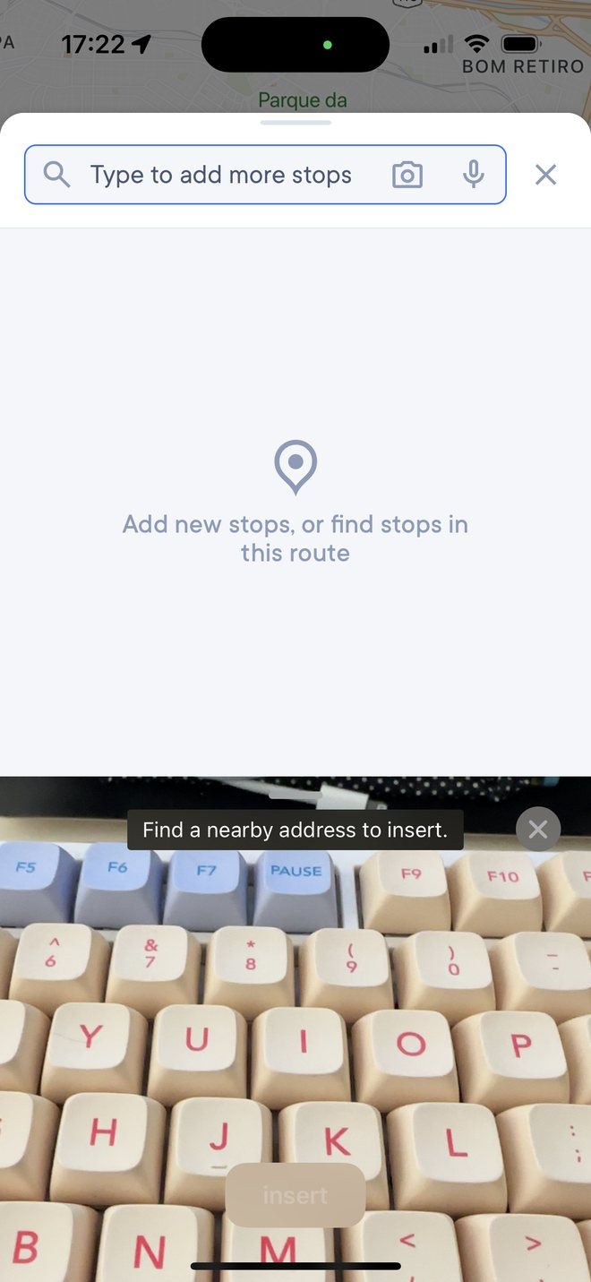 Previous iOS flow: the search field with a live camera view below it, prompting to find a nearby address.